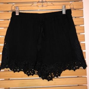 black intricate shorts.